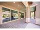 Covered patio with brick pavers leading to the pool and backyard at 12018 Vento Forte Ave, Las Vegas, NV 89138