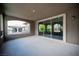 Large covered patio, perfect for outdoor dining, with views through glass doors at 12018 Vento Forte Ave, Las Vegas, NV 89138