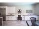 Dining area features custom cabinetry with countertops, stainless refrigerator, and decorative star accent at 12018 Vento Forte Ave, Las Vegas, NV 89138