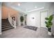 Grand foyer showcasing tile flooring, a staircase, recessed lighting, and elegant decor at 12018 Vento Forte Ave, Las Vegas, NV 89138