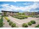 Picturesque community garden with stone pathways and symmetrical landscaping leading to the Altura entrance at 12018 Vento Forte Ave, Las Vegas, NV 89138