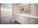 Upstairs hallway featuring white trim, neutral paint, and an artistic cow photograph at 12018 Vento Forte Ave, Las Vegas, NV 89138