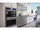 The well-equipped kitchen boasts stainless steel appliances and modern cabinetry, enhancing both style and functionality at 12018 Vento Forte Ave, Las Vegas, NV 89138