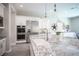 Bright kitchen with stainless steel appliances, granite countertops, and stylish pendant lighting at 12018 Vento Forte Ave, Las Vegas, NV 89138