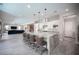 The open-concept kitchen features a large center island with seating, creating a hub for casual dining and social interaction at 12018 Vento Forte Ave, Las Vegas, NV 89138