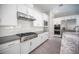 Well-equipped kitchen with stainless steel appliances and stylish white cabinetry at 12018 Vento Forte Ave, Las Vegas, NV 89138