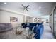 Spacious living room boasting tile flooring, a comfortable sofa, recessed lighting, and an open layout at 12018 Vento Forte Ave, Las Vegas, NV 89138