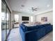 Open-concept living room featuring contemporary furnishings and direct access to the backyard at 12018 Vento Forte Ave, Las Vegas, NV 89138