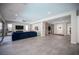 Open-concept layout with modern gray tile flooring, lots of natural light and backyard views at 12018 Vento Forte Ave, Las Vegas, NV 89138