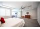 Spacious main bedroom with large bed, ceiling fan, natural light, and neutral decor at 12018 Vento Forte Ave, Las Vegas, NV 89138