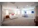 Spacious main bedroom with large bed, ceiling fan, natural light, and neutral decor at 12018 Vento Forte Ave, Las Vegas, NV 89138