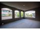 Spacious covered patio with arched windows offers views of the community at 12018 Vento Forte Ave, Las Vegas, NV 89138