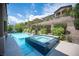 Backyard pool and spa with mature landscaping at 12018 Vento Forte Ave, Las Vegas, NV 89138