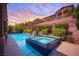 Beautiful pool and spa with patio for outdoor relaxation in this backyard at 12018 Vento Forte Ave, Las Vegas, NV 89138