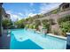 Sparkling swimming pool with built-in spa and lush landscaping at 12018 Vento Forte Ave, Las Vegas, NV 89138