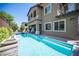 Backyard swimming pool and spa with unique stone details at 12018 Vento Forte Ave, Las Vegas, NV 89138