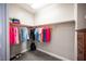 Walk-in closet featuring wood shelves and hanging rods at 12018 Vento Forte Ave, Las Vegas, NV 89138