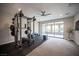 Bright workout room featuring weight-lifting equipment and access to covered patio at 12018 Vento Forte Ave, Las Vegas, NV 89138