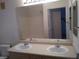Bathroom with double sink vanity and large mirror at 1401 N Michael Way # 244, Las Vegas, NV 89108