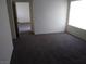 Bedroom featuring neutral walls, carpet, and natural light from the window at 1401 N Michael Way # 244, Las Vegas, NV 89108
