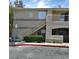 Exterior of a two-story apartment building with stairs and a small patio at 1401 N Michael Way # 244, Las Vegas, NV 89108