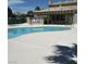 Community pool with a shaded seating area and desert landscaping at 1401 N Michael Way # 244, Las Vegas, NV 89108
