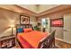 Comfortable bedroom featuring wood floors, earth tone walls, and bright, colorful bedspread and throw pillows at 150 Las Vegas Blvd # 1606, Las Vegas, NV 89101
