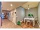 Neutral dining area with hardwood flooring, a modern table, and views to the hallway at 150 Las Vegas Blvd # 1606, Las Vegas, NV 89101