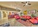 Inviting living room with plush red seating, tile floors, and a colorful rug at 150 Las Vegas Blvd # 1606, Las Vegas, NV 89101