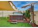 Backyard with hot tub, shade sails, and artificial grass at 167 Thunder Plains Way, Henderson, NV 89012
