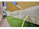 Backyard featuring artificial grass and shade sails at 167 Thunder Plains Way, Henderson, NV 89012