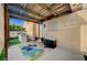 Charming backyard patio featuring shaded pergola, artificial turf, and cozy outdoor seating at 167 Thunder Plains Way, Henderson, NV 89012