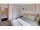 Bright bedroom with plush bedding, neutral walls and closet with sliding doors at 167 Thunder Plains Way, Henderson, NV 89012