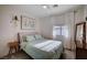 Bright bedroom with stylish decor, neutral walls, natural light and plush bedding at 167 Thunder Plains Way, Henderson, NV 89012