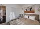 Comfortable bedroom featuring neutral tones, a southwest themed tapestry, and a large closet with sliding doors at 167 Thunder Plains Way, Henderson, NV 89012