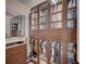 Organized walk-in closet with custom shelving, cabinets with glass doors, and ample storage space at 167 Thunder Plains Way, Henderson, NV 89012