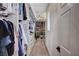 Spacious walk-in closet featuring custom shelving, drawers, and ample space for storage, organization, and access at 167 Thunder Plains Way, Henderson, NV 89012
