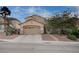 Inviting two-story home with a well-manicured lawn and a spacious two-car garage at 167 Thunder Plains Way, Henderson, NV 89012