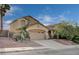 Charming two-story home featuring a well-maintained lawn and a two-car garage at 167 Thunder Plains Way, Henderson, NV 89012