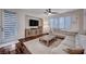 Comfortable living room with large sectional sofa, neutral tones, and media console at 167 Thunder Plains Way, Henderson, NV 89012