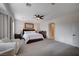 Spacious primary bedroom with sitting area, large windows, neutral decor, and ensuite access at 167 Thunder Plains Way, Henderson, NV 89012