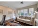 Open office with couch, large windows, and a cozy design that makes working from home a breeze at 167 Thunder Plains Way, Henderson, NV 89012