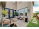 Charming patio area with comfortable seating, a fountain, and lush landscaping at 167 Thunder Plains Way, Henderson, NV 89012