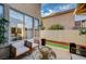 Cozy outdoor patio features comfortable seating, a decorative water fountain, and ample natural light at 167 Thunder Plains Way, Henderson, NV 89012