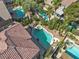 Aerial view of backyard oasis, a pool, spa, and lush landscaping at 1717 Double Arch Ct, Las Vegas, NV 89128