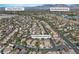 An aerial view of a residential area, featuring the home at 1717 Double Arch Ct, with nearby parks at 1717 Double Arch Ct, Las Vegas, NV 89128