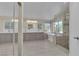 Spacious bathroom features double vanity, soaking tub, and walk-in shower with neutral tile at 1717 Double Arch Ct, Las Vegas, NV 89128