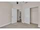 Bedroom with carpet and closet with a laundry room through the doorway at 1717 Double Arch Ct, Las Vegas, NV 89128