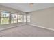 Bright bedroom featuring neutral walls, carpeted floors, and windows providing great natural light at 1717 Double Arch Ct, Las Vegas, NV 89128