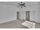Spacious bedroom with vaulted ceilings, a ceiling fan, and dual closets at 1717 Double Arch Ct, Las Vegas, NV 89128